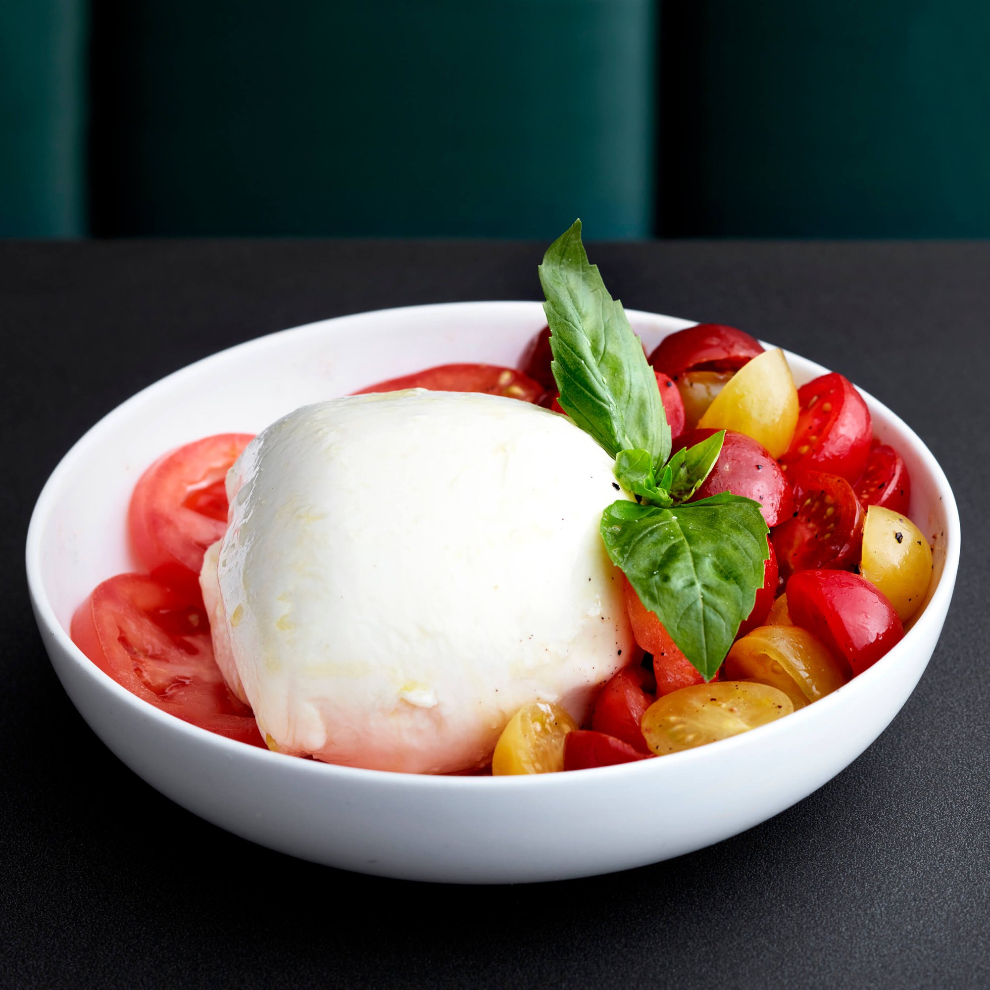 Tomato, mozzarella and basil dish.